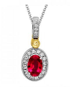 An oval ruby gem surrounded by diamonds as a pendant