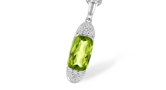 Close up image of a silver peridot and diamond necklace by Allison-Kaufman